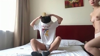 A Pair Of Chinese Lovers Indulge In Intimacy In A Hotel Room