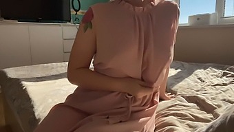A Delicate Woman In A Pink Dress Explores Her Intimate Areas